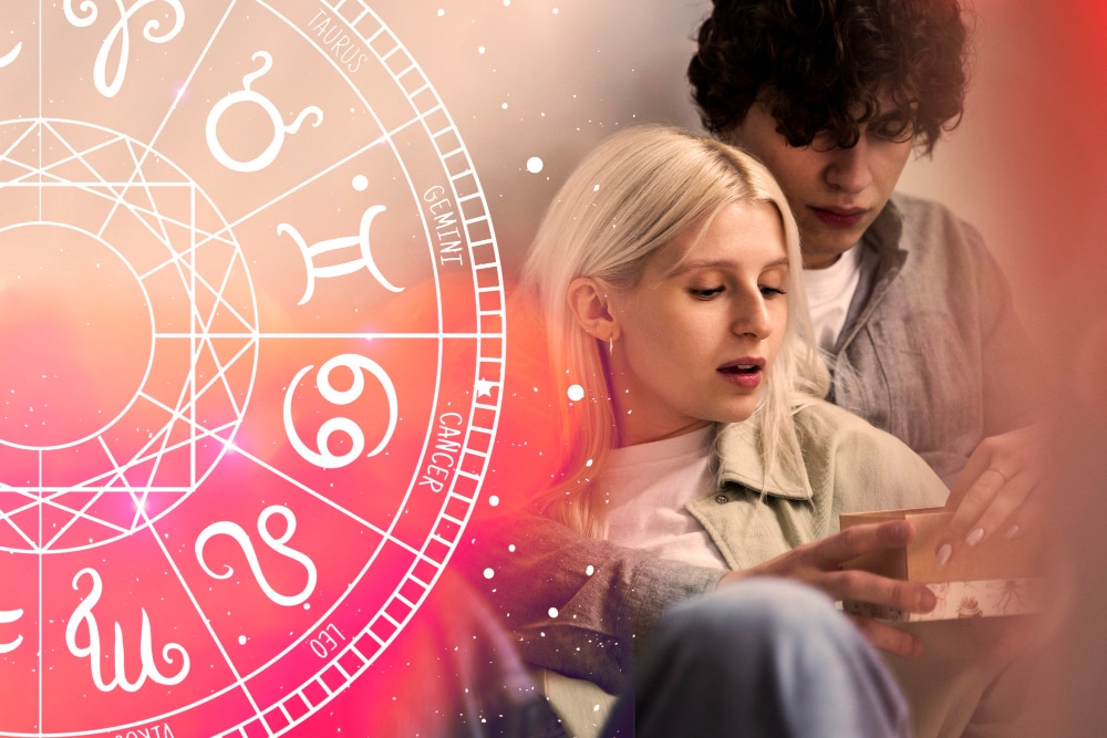 un couple enlacé avec un tableau des signes astrologiques rose sur le côté